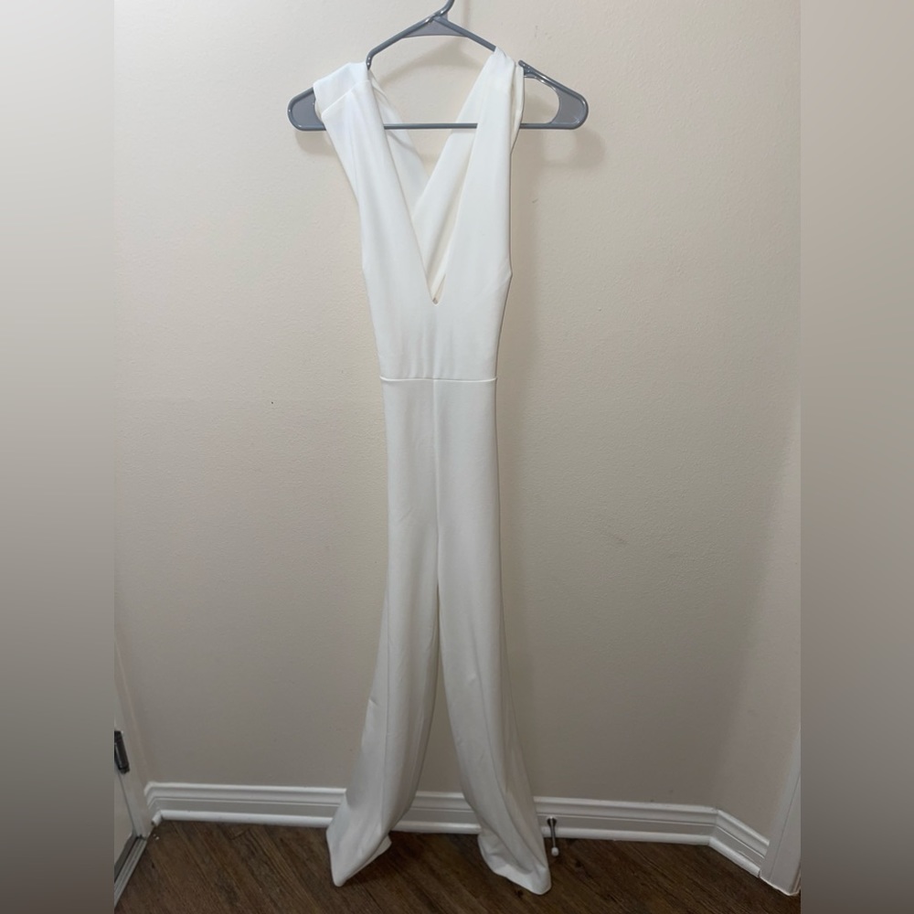 White jumpsuit- size small. *New with tags*